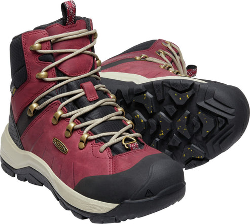 Pair of maroon hiking boots with gold eyelets and black soles.