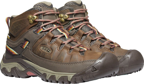 Pair of brown leather hiking boots with pink and yellow laces.