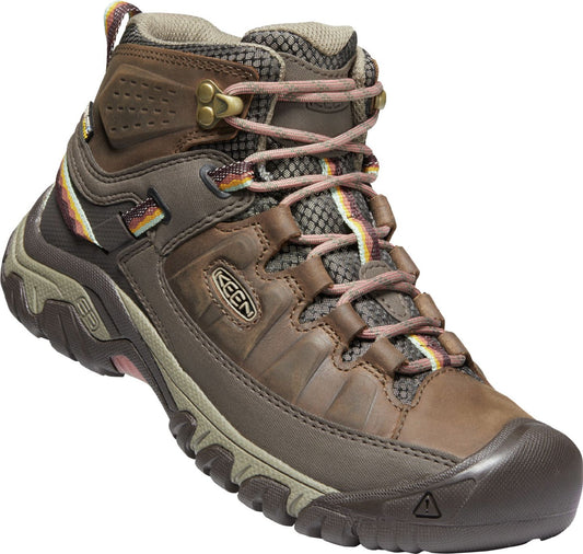 Brown leather hiking boot with pink and brown laces.