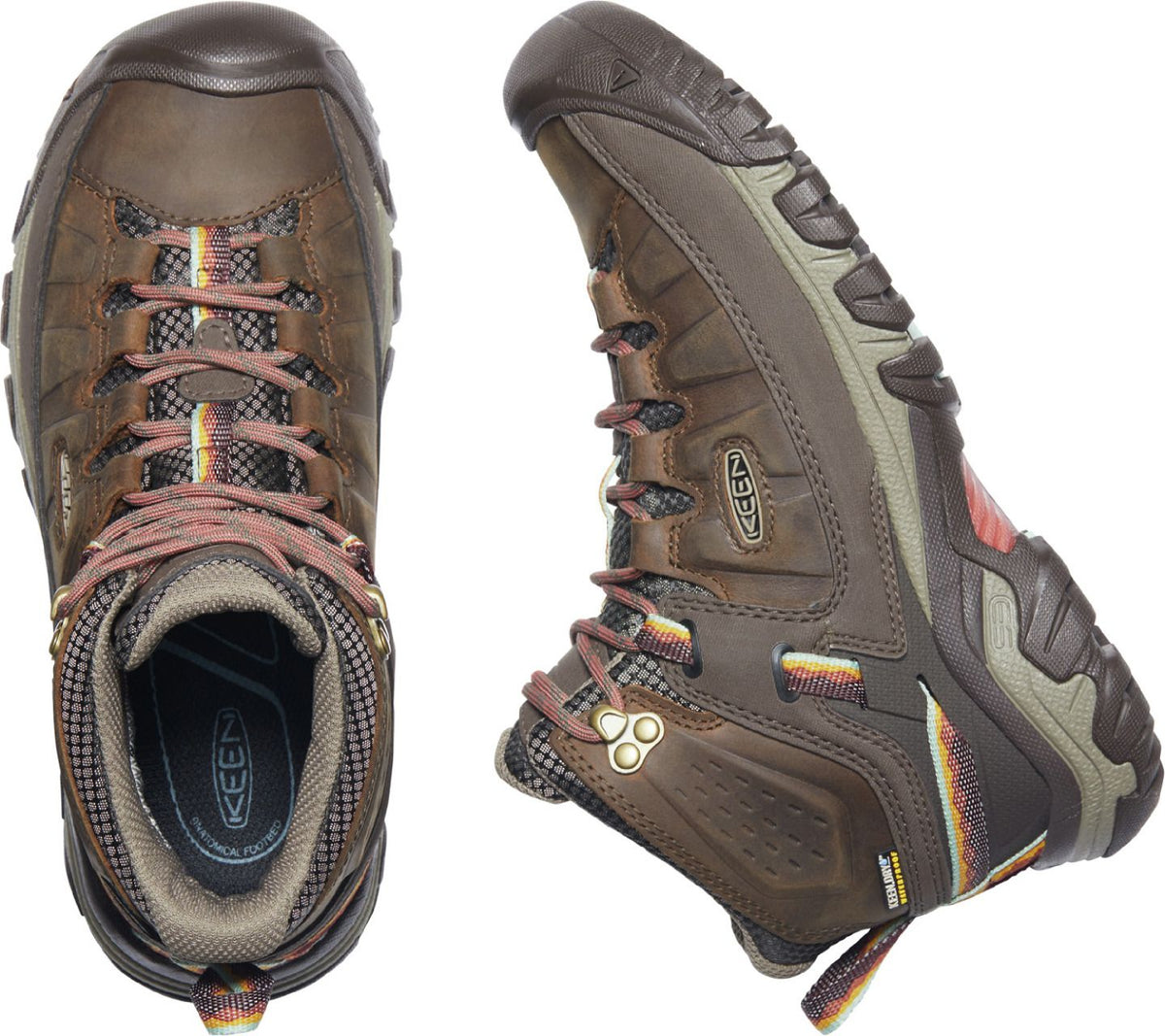 A pair of brown, mid-height hiking boots with lace-up closures, lugged soles, and protective toe caps.