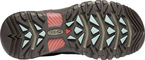 A shoe sole with brown treads and geometric colored elements.