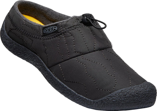 Slip-on shoe in quilted black material with elastic cord and KEEN logo on a tag.