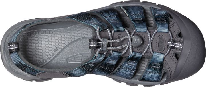 Overhead view of a sandal with blue, gray, and white woven straps.