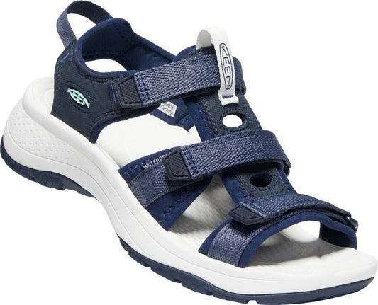 A navy blue water sandal with adjustable straps and a white sole.