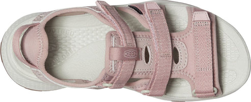 A pink sandal with straps and a white footbed.