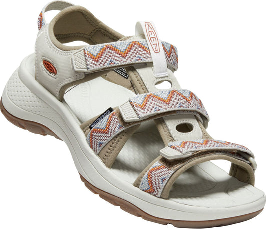 Beige sandal with patterned straps, waterproof label.