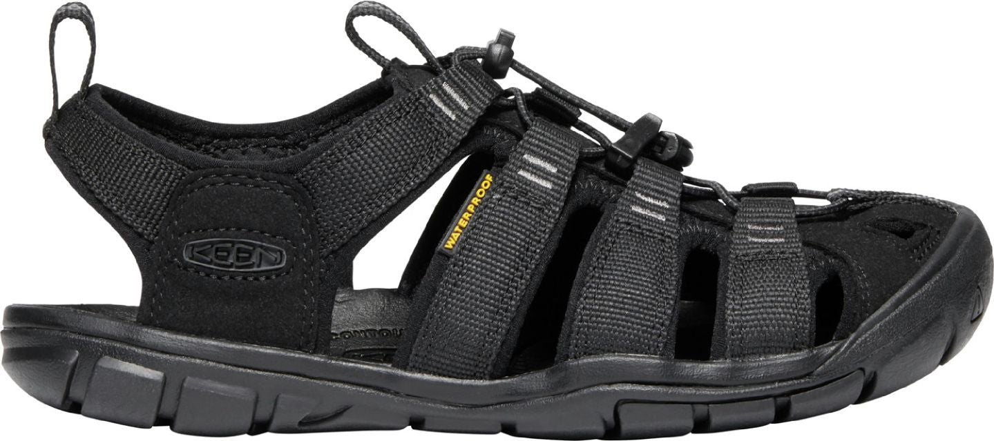 A black sport sandal with an adjustable elastic cord closure and a small yellow tag that reads "WATERPROOF".