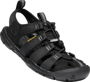 Black sandal with webbed straps and a toggle lacing system.