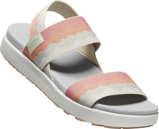 Angled view of a KEEN Women's Astoria West Zig Sandal, featuring two zigzag-patterned pink and beige straps over the top of a white sole.