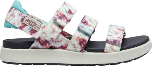 A sandal with purple and blue abstract pattern and aqua heel.