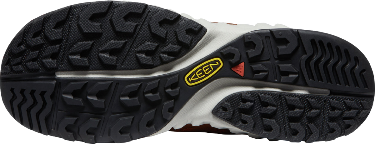 The underside of a shoe showing its tread and a yellow KEEN logo.