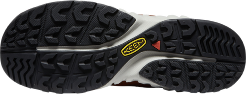 The underside of a shoe showing its tread and a yellow KEEN logo.