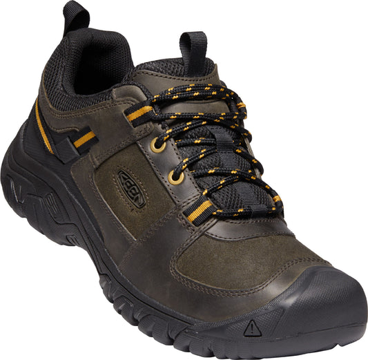 Leather hiking shoe with black laces and a black rubber sole.