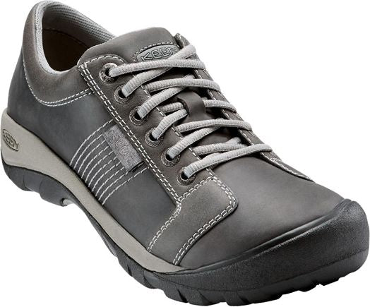 A gray leather lace-up shoe with a round black toe and light gray laces.
