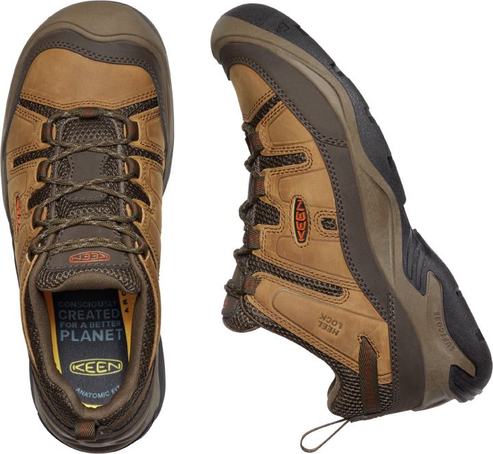 Overhead and side view of a brown leather work shoe with laces, KEEN logo on the side, and text inside the shoe that says "conscious created for a better planet".
