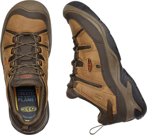 Overhead and side view of a brown leather work shoe with laces, KEEN logo on the side, and text inside the shoe that says "conscious created for a better planet".