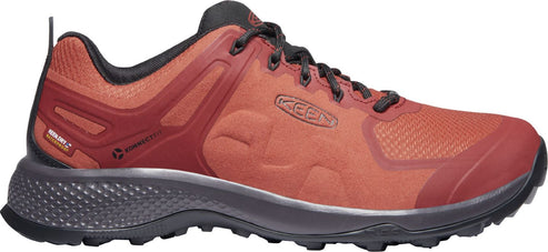 A hiking shoe with a brown upper and a black sole.