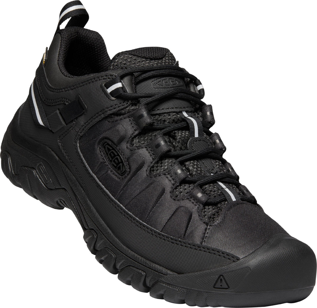 A black low top hiking shoe with a round toe, black laces, and a pull tab.
