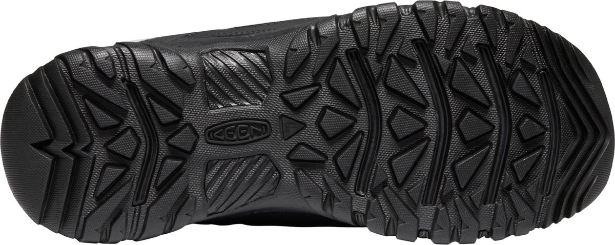 Black shoe sole with geometric tread patterns.