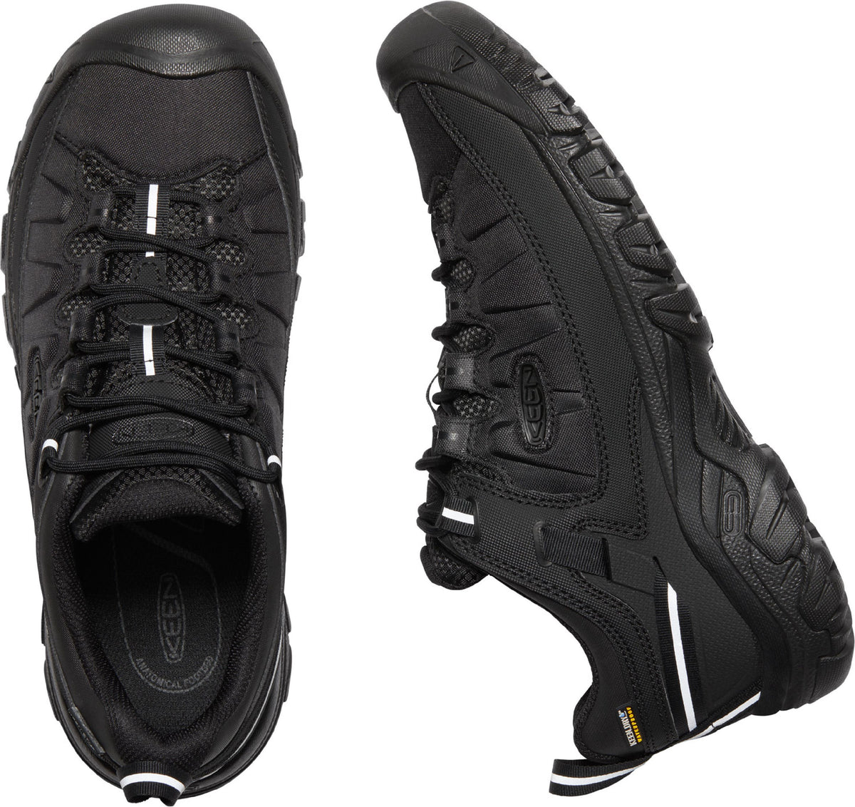 A pair of black hiking shoes with black laces.