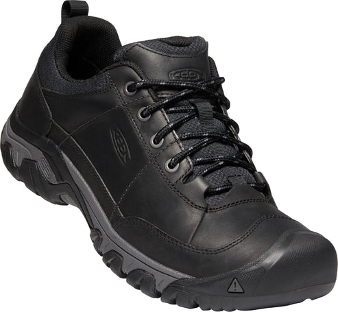 Low-cut black hiking shoe with lugged outsole and lace-up closure.