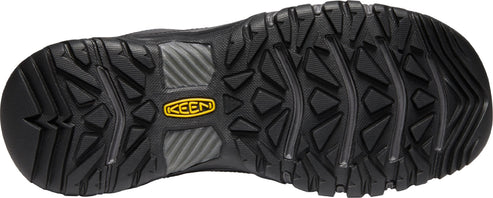 The black lug outsole of a shoe with a yellow KEEN logo.