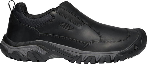 Black slip-on shoe with a lug sole and toe cap.