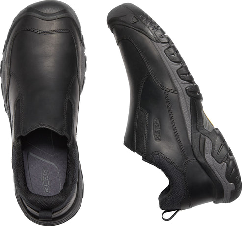 Two black leather slip-on shoes shown from top and side, showing the rubber outsole, elastic side panels and grey insole.
