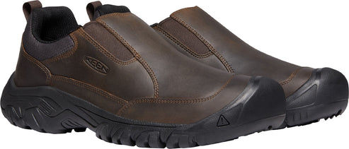 A pair of brown leather slip-on shoes with black soles.