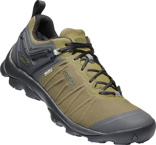 A low-cut hiking shoe in olive green and black, featuring waterproof technology and a sturdy black sole.