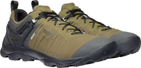 A pair of olive green and black athletic shoes with black laces.
