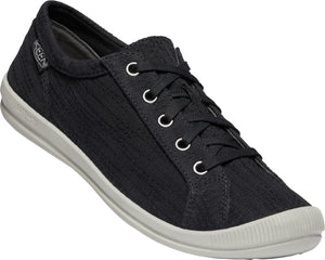 A black textile low-top sneaker with white laces and a white sole.