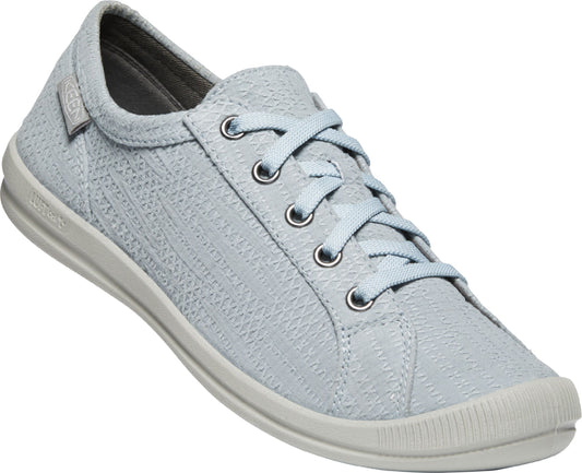 Light blue sneaker with patterned upper, lace-up closure, and a white sole.