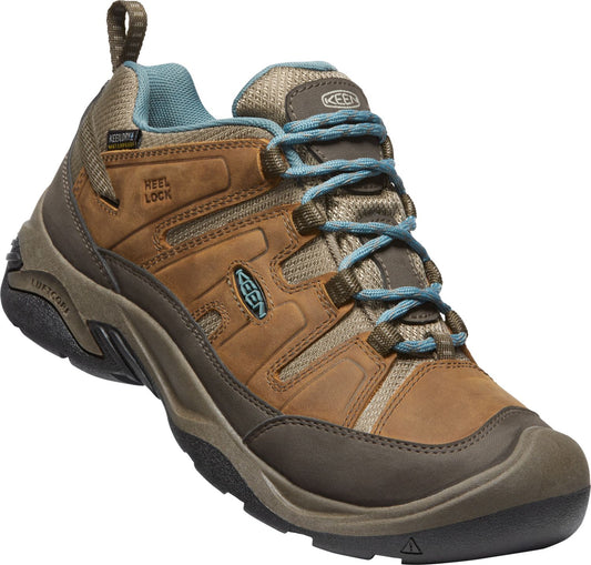 Brown leather hiking shoe with blue laces and lining.
