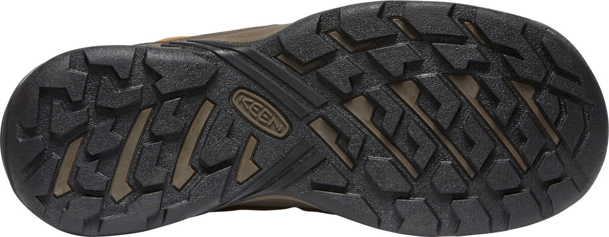 Bottom of a shoe with treads and the word KEEN embossed in the sole.