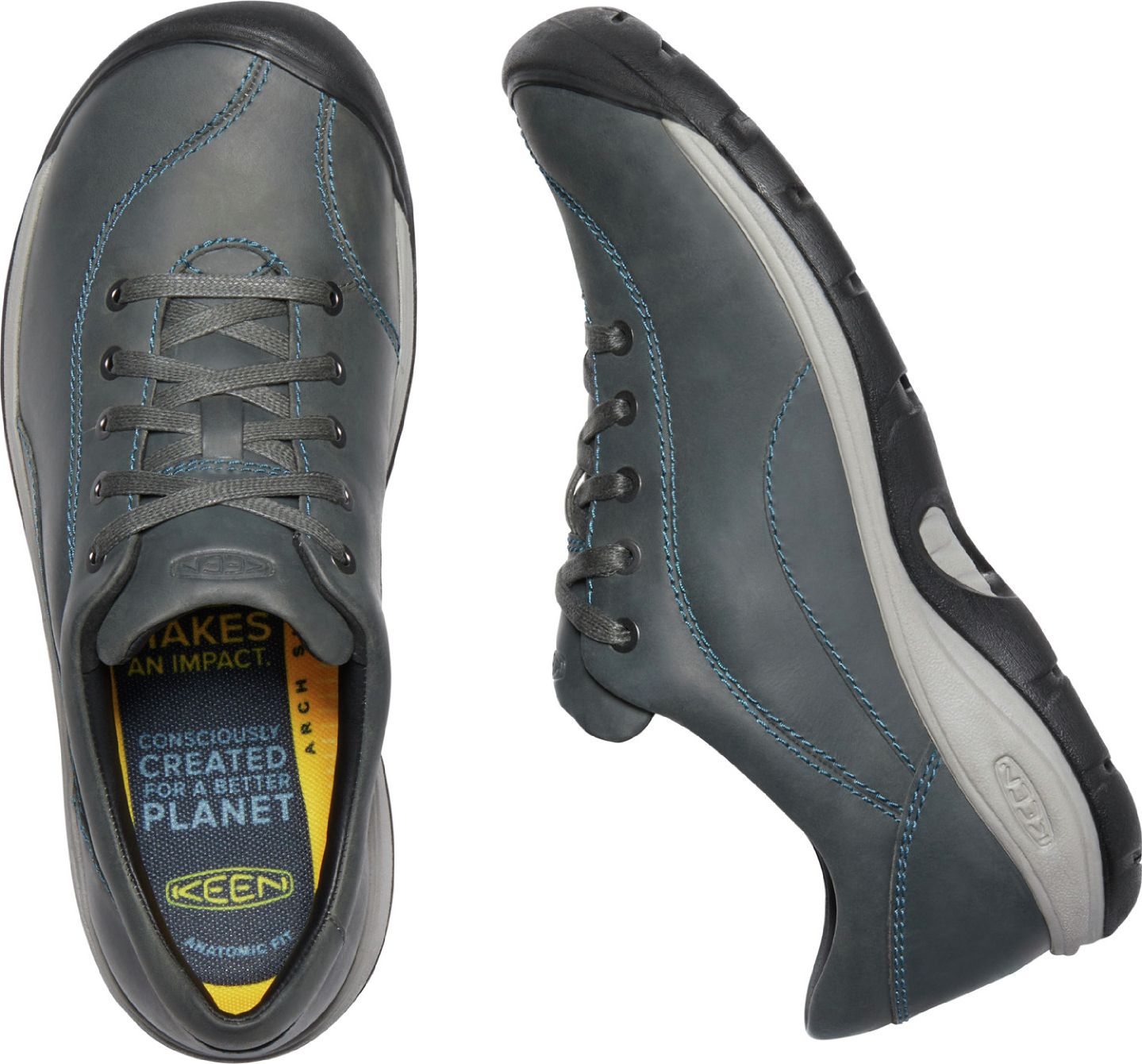 Two gray shoes with blue stitch detailing, one shown from above with laces and footbed visible.