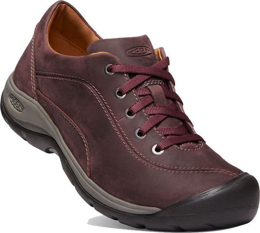 Oxblood-colored leather sneaker with a gray sole and maroon laces