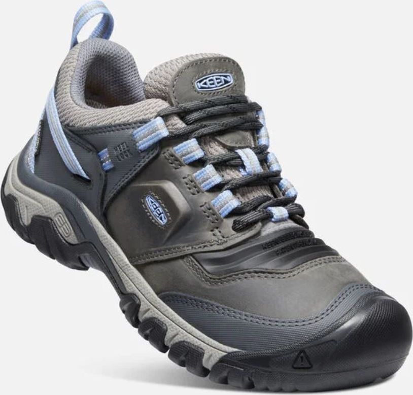 Gray hiking shoe with blue accents, loop at heel, and lug sole.