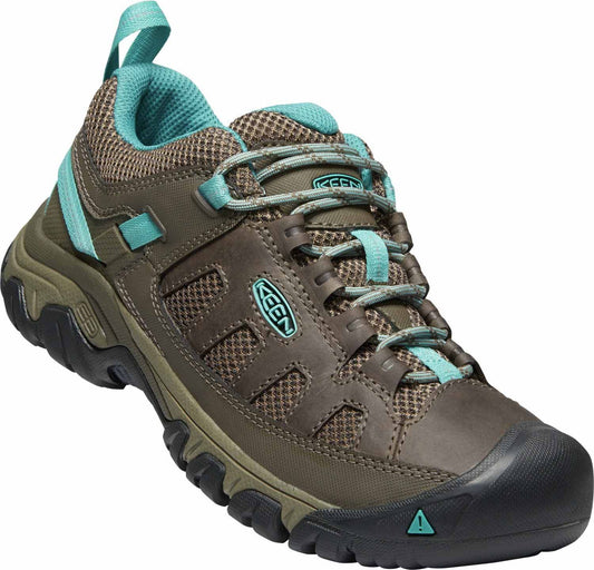 Brown hiking shoe with teal accents, lugged sole, and lace-up closure.