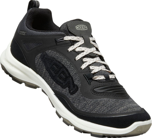Low-profile hiking shoe with black and gray uppers, a white midsole, a lugged sole, and white laces.