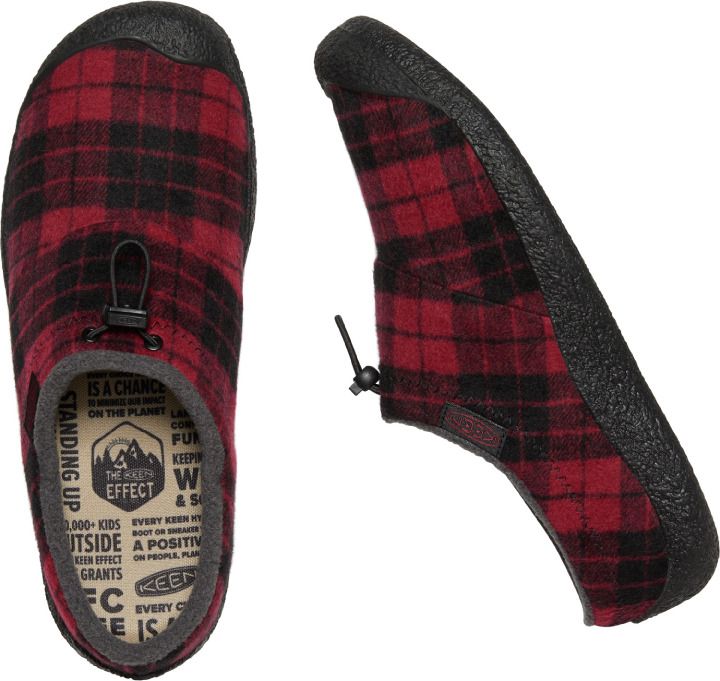 Two views of a red and black plaid slipper with a black sole and toggle closure.