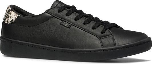 A black low-top sneaker with black laces and a snakeskin pattern on the heel.