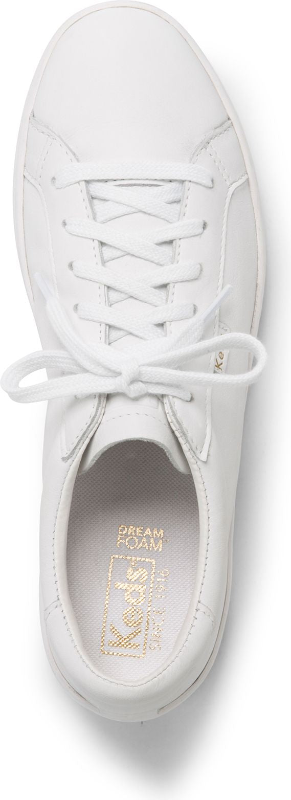 white sneaker with white laces and gold lettering inside