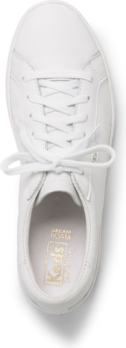 white sneaker with white laces and gold lettering inside