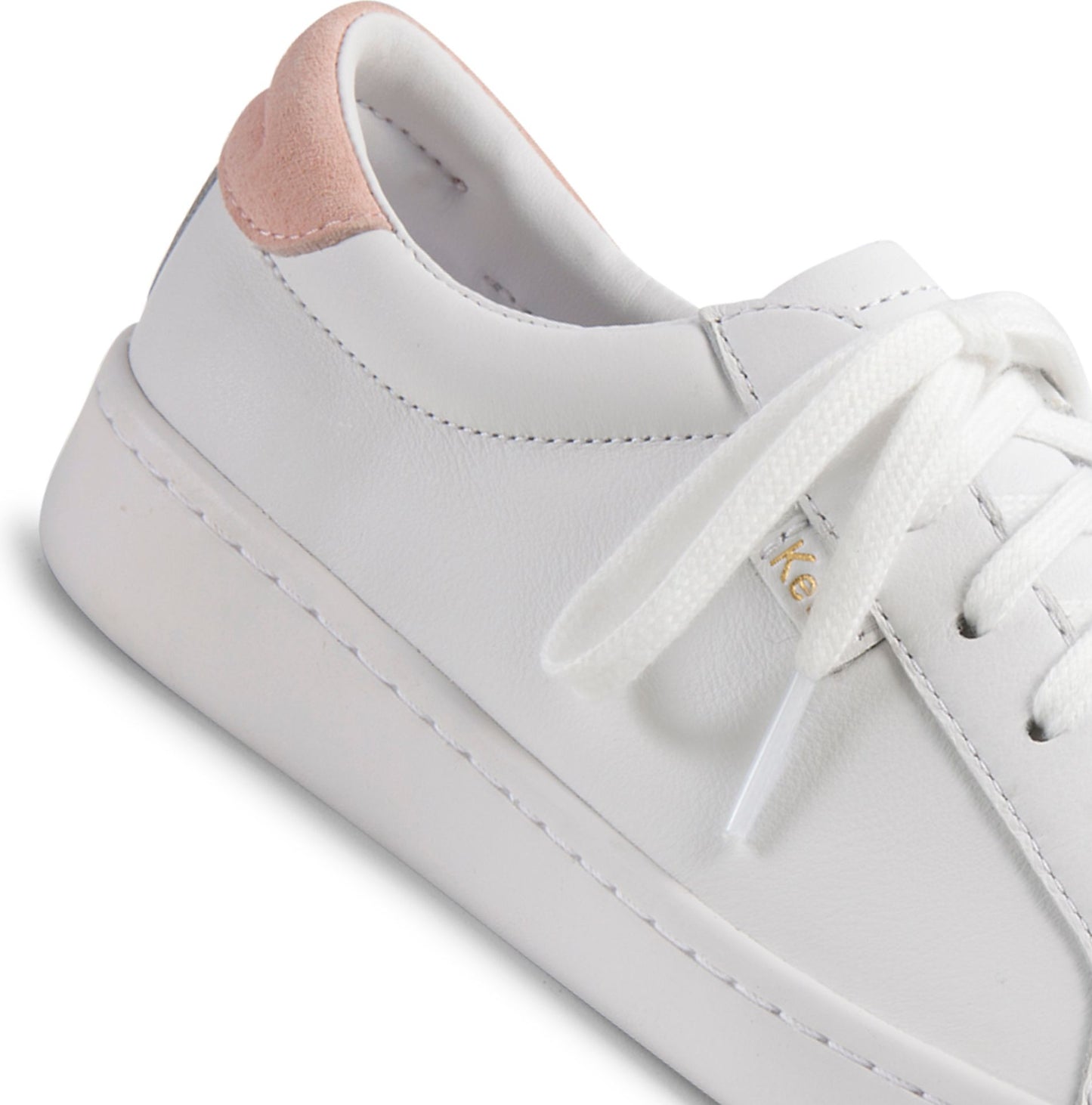 White leather sneaker with white laces and a pink heel.