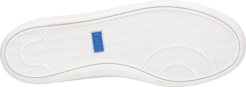 A white shoe sole with a blue label.