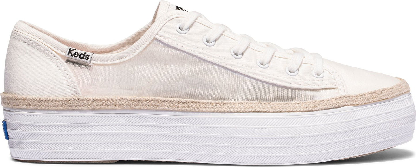 A white sneaker with a thick white platform sole and the word "Keds" visible near the heel.