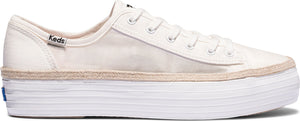 A white sneaker with a thick white platform sole and the word "Keds" visible near the heel.