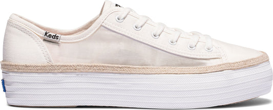 A white sneaker with a thick white platform sole and the word "Keds" visible near the heel.