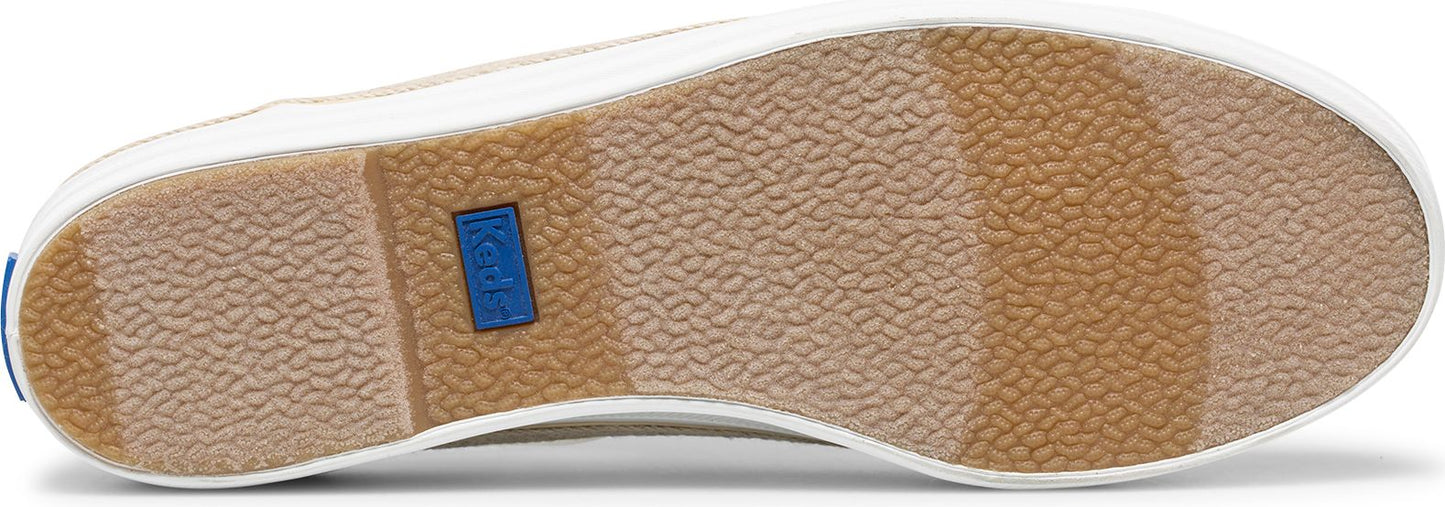 The sole of a shoe with a textured tan tread and a white border.